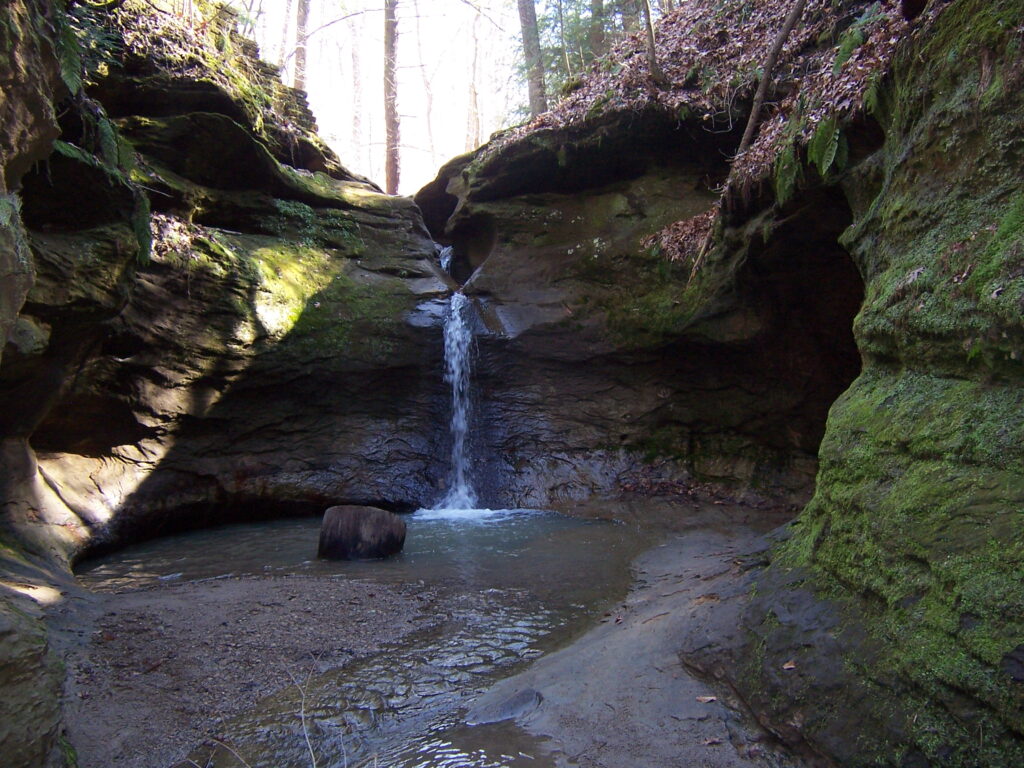 waterfall in punchbowl formed in sandstone cliffs