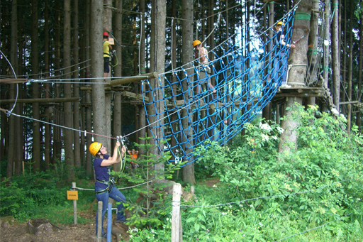 Aerial rope course in the trees. These are great places to practice overcoming your fear of heights for hiking. 